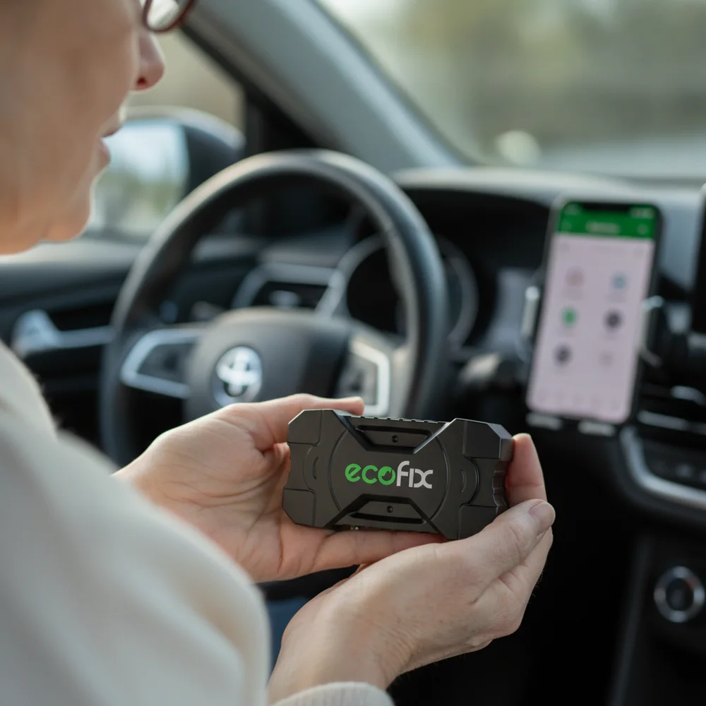 EcoFix held in a driver's palm, about the size of a matchbox